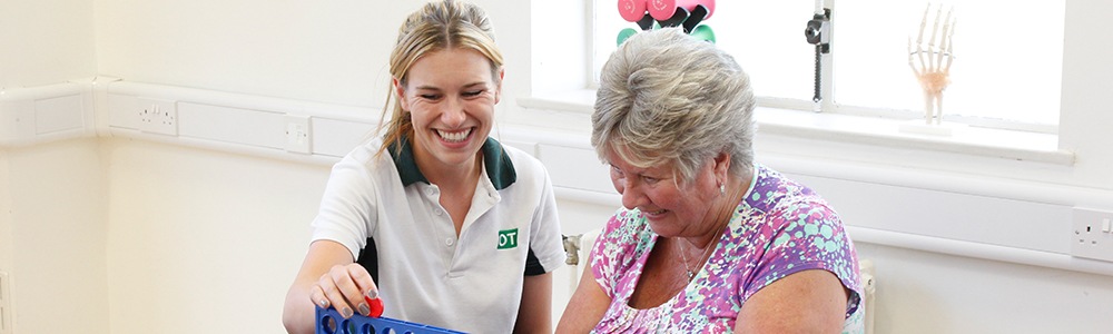 Liverpool OT and her client smiling during her treatment.