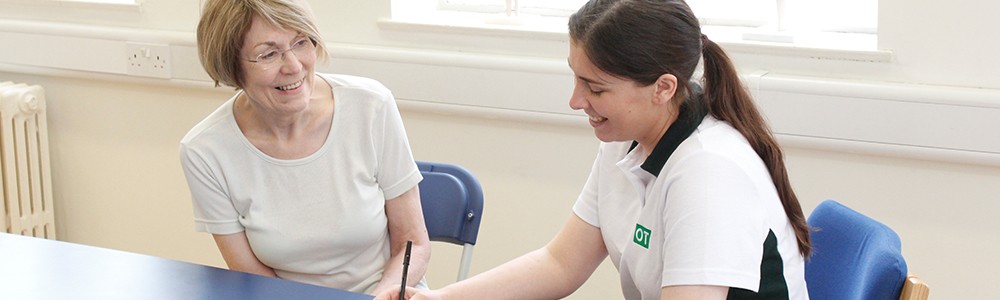 Liverpool OT client and patient smile and laugh during chat.