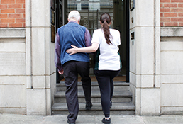 Patient and client enter Liverpool OT clinic together.
