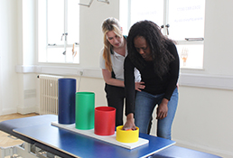 Liverpool OT patient stacks block during routine therapy session.